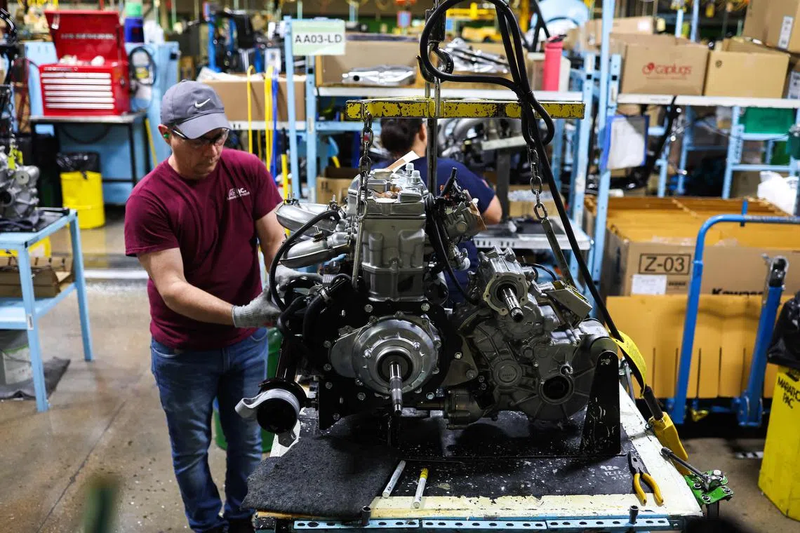 (FILES) An employee works in Kawasaki factory in Lincoln, Nebraska, on May 13, 2024. The US added 206,000 jobs in June, said the Labor Department on July 5, 2024,, marking a slower pace of hiring than May's revised 218,000 figure. The jobless rate ticked up from 4.0 percent to 4.1 percent. (Photo by Charly TRIBALLEAU / AFP)