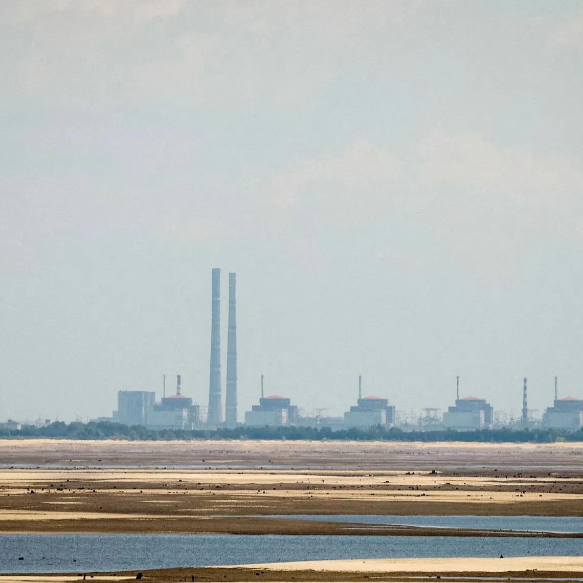 FILE PHOTO: A view shows Zaporizhzhia Nuclear Power Plant from the bank of Kakhovka Reservoir near the town of Nikopol after the Nova Kakhovka dam breached, amid Russia's attack on Ukraine, in Dnipropetrovsk region, Ukraine June 16, 2023. REUTERS/Alina Smutko/File Photo