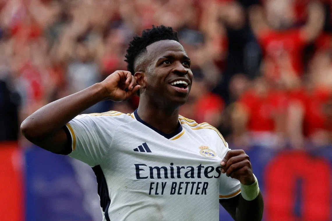 FILE PHOTO: Soccer Football - LaLiga - Osasuna v Real Madrid - El Sadar Stadium, Pamplona, Spain - March 16, 2024 Real Madrid's Vinicius Junior celebrates scoring their fourth goal REUTERS/Vincent West/File Photo