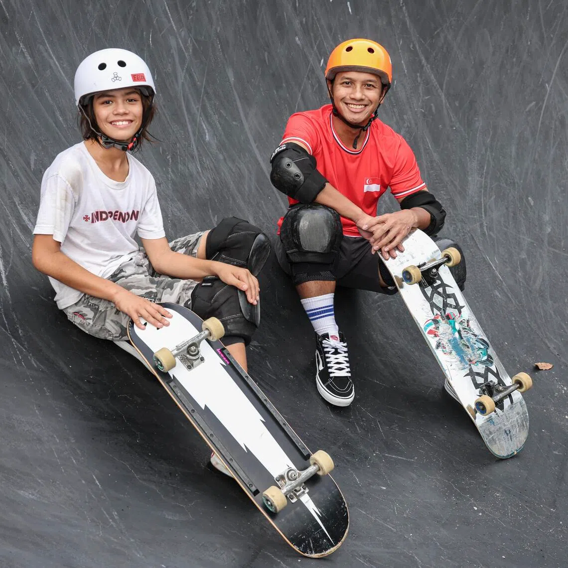 ST20251202_202566000623/jcskate02/Brian Teo/Joel Chang/(From Left)Profile of national skateboarders Felix Balzer, 11, and Farris Rahman, 31, at SkatePark @ Lakeside Garden on Dec 2, 2025.  ST PHOTO: BRIAN TEO 