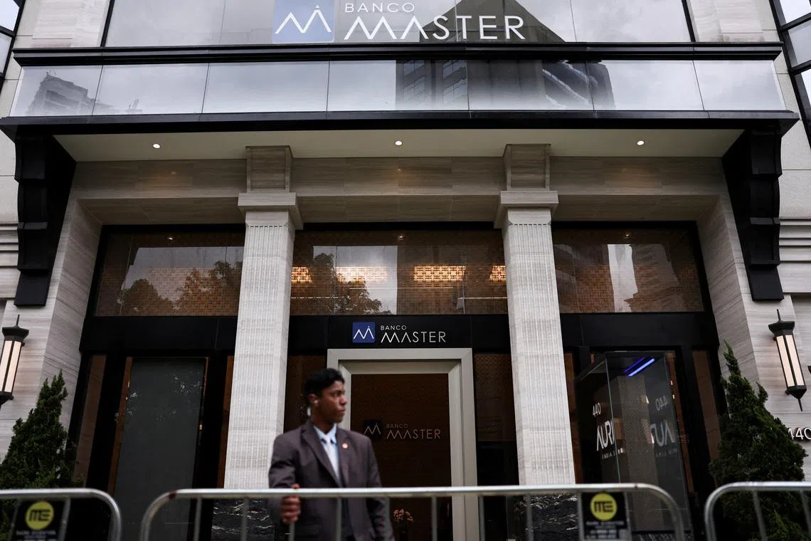 FILE PHOTO: A security guard stands outside Bank Master (Banco Master), following the arrest of the controlling shareholder of lender Banco Master, businessman Daniel Vorcaro, in Sao Paulo, Brazil, November 18, 2025. REUTERS/ Amanda Perobelli/File Photo