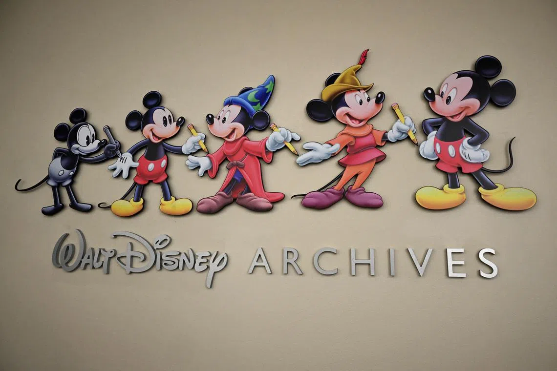 (FILES) Mickey Mouse animations annouce the entrance to the Walt Disney Archives during a media tour of the Disney Studio and Walt Disney Archives,on June 20, 2023 at the Disney Studio lot, in Burbank, California. Almost a century after his big-screen debut, Mickey Mouse enters the public domain on January 1, 2024, opening the floodgates to potential remakes, spin-offs, adaptations... and legal battles with Disney.
The copyright on "Steamboat Willie" -- a short, black-and-white 1928 animation that first introduced audiences to the mischievous rodent who would become emblematic of American pop culture -- expires after 95 years, on January 1, under US law. (Photo by Robyn Beck / AFP)