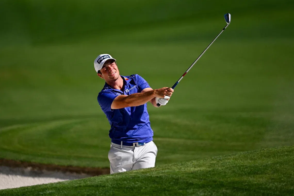 Viktor Hovland of Norway plays a shot from a bunker on the 18th hole during the third round of the PGA Championship.