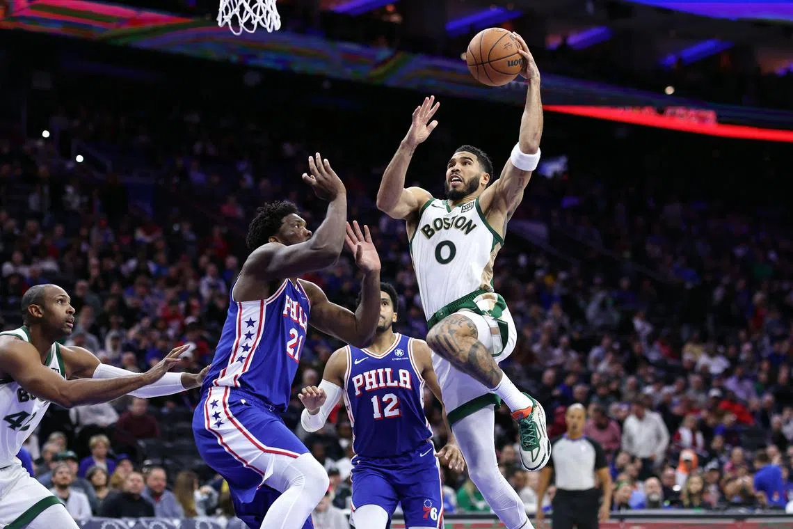 Short-handed Boston Celtics down Philadelphia 76ers, Damian Lillard ...