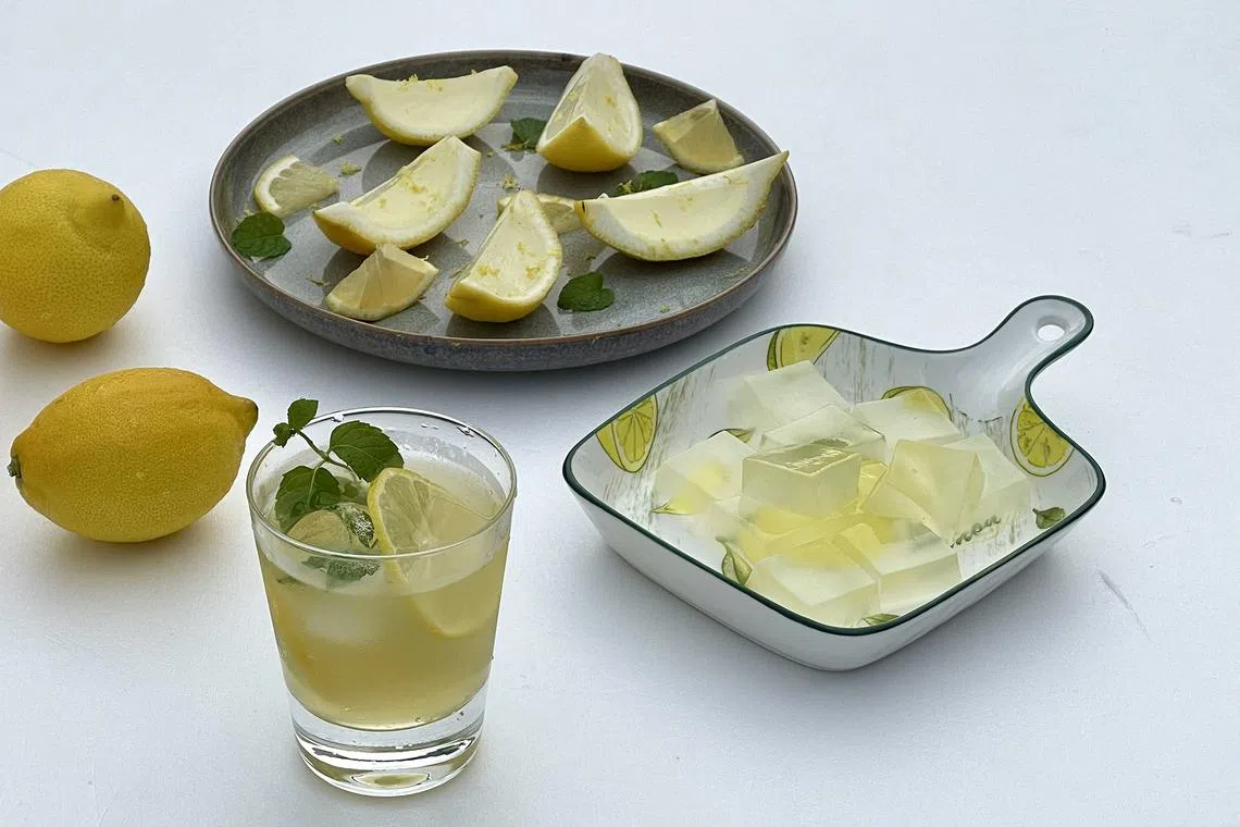 (Clockwise from top left) Lemon jelly in lemon cups, lemon jelly cut into squares and a limoncello cocktail.