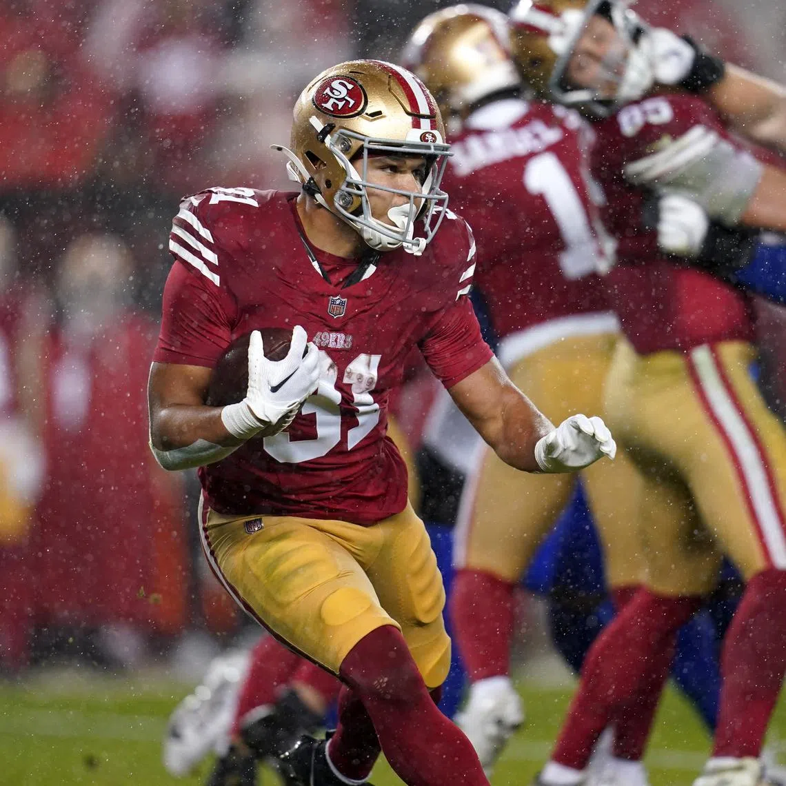 Dec 12, 2024; Santa Clara, California, USA; San Francisco 49ers running back Isaac Guerendo (31) runs the ball against the Los Angeles Rams in the second quarter at Levi's Stadium. Cary Edmondson-Imagn Images/File Photo