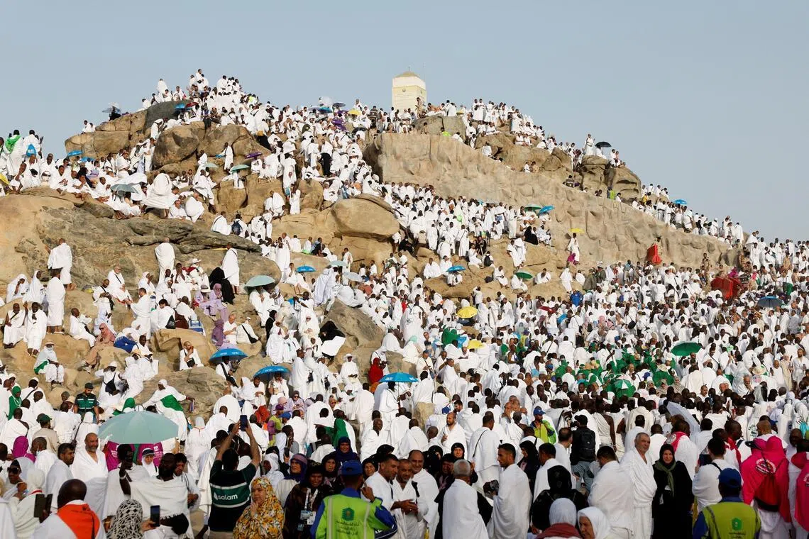 Muslim pilgrims gather at the Mount of Mercy on the plain of Arafat during the annual haj pilgrimage.
