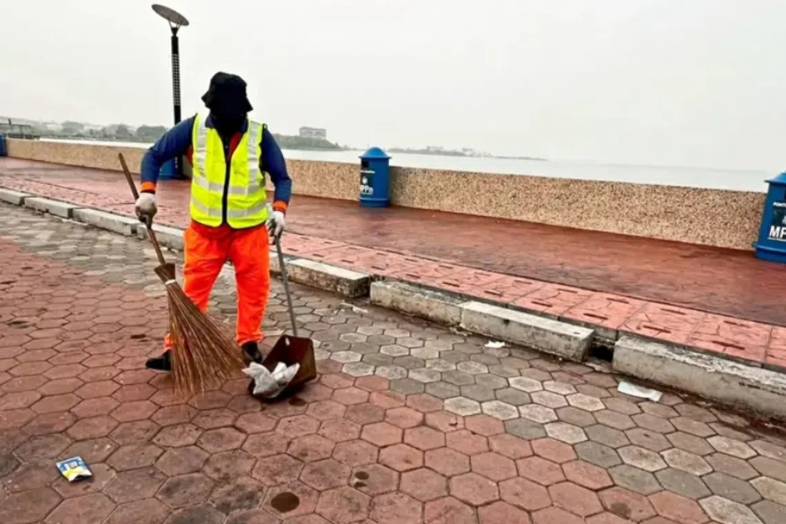 Street sweeper Mohd Rizan Mehran sticks to his daily work routine despite having to work in a more challenging environment.