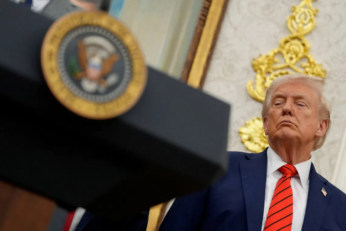 FILE PHOTO: U.S. President Donald Trump listens during an announcement about lowering U.S. drug prices, at the White House in Washington, D.C., U.S., October 10, 2025. REUTERS/Kent Nishimura/File Photo