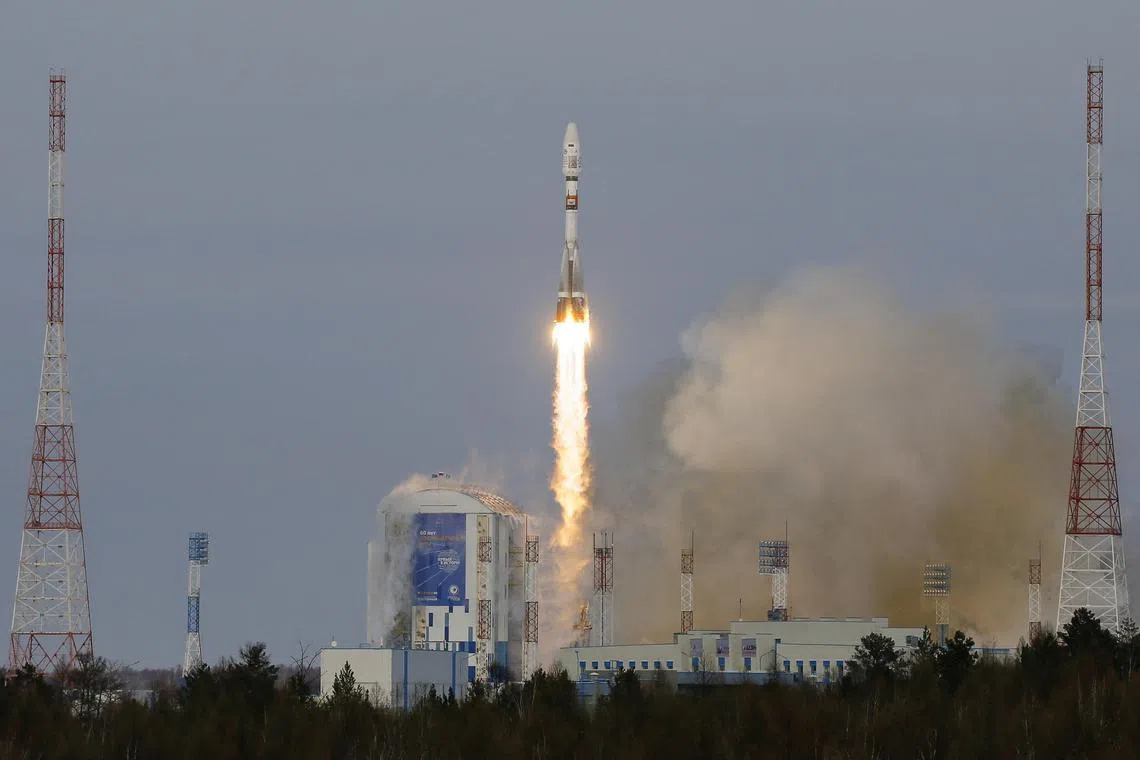 A 2017 photo shows a space vehicle carrying satellites taking off from Russia's Vostochny cosmodrome.