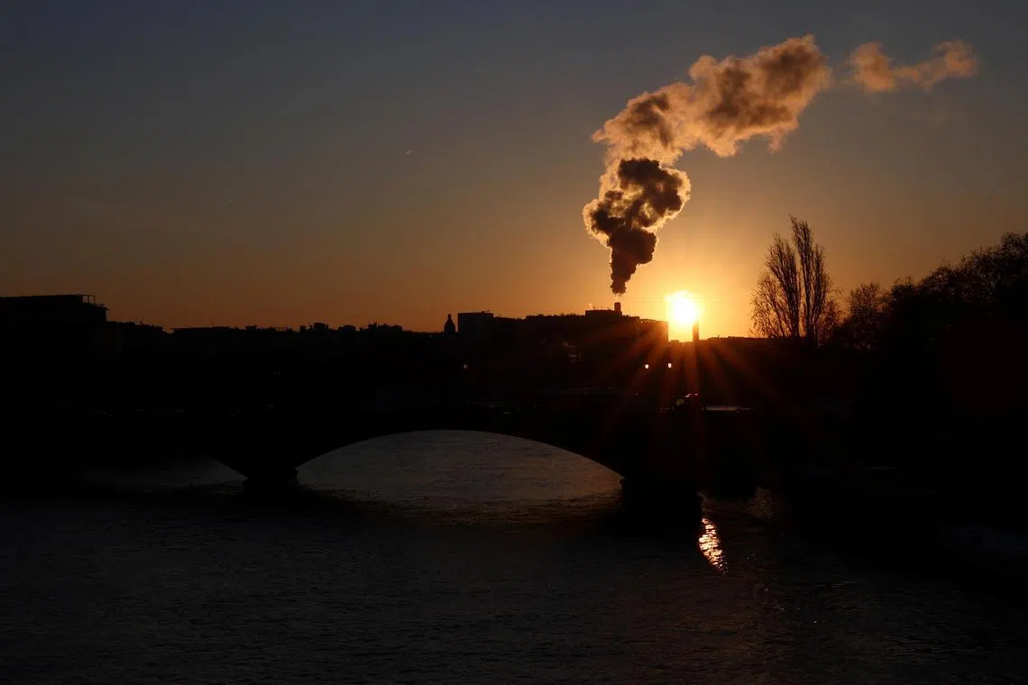 Water vapour billows from smokestacks at the incineration plant of Ivry-sur-Seine, near Paris, as the sun rises, France, January 19, 2024. REUTERS/Stephanie Lecocq