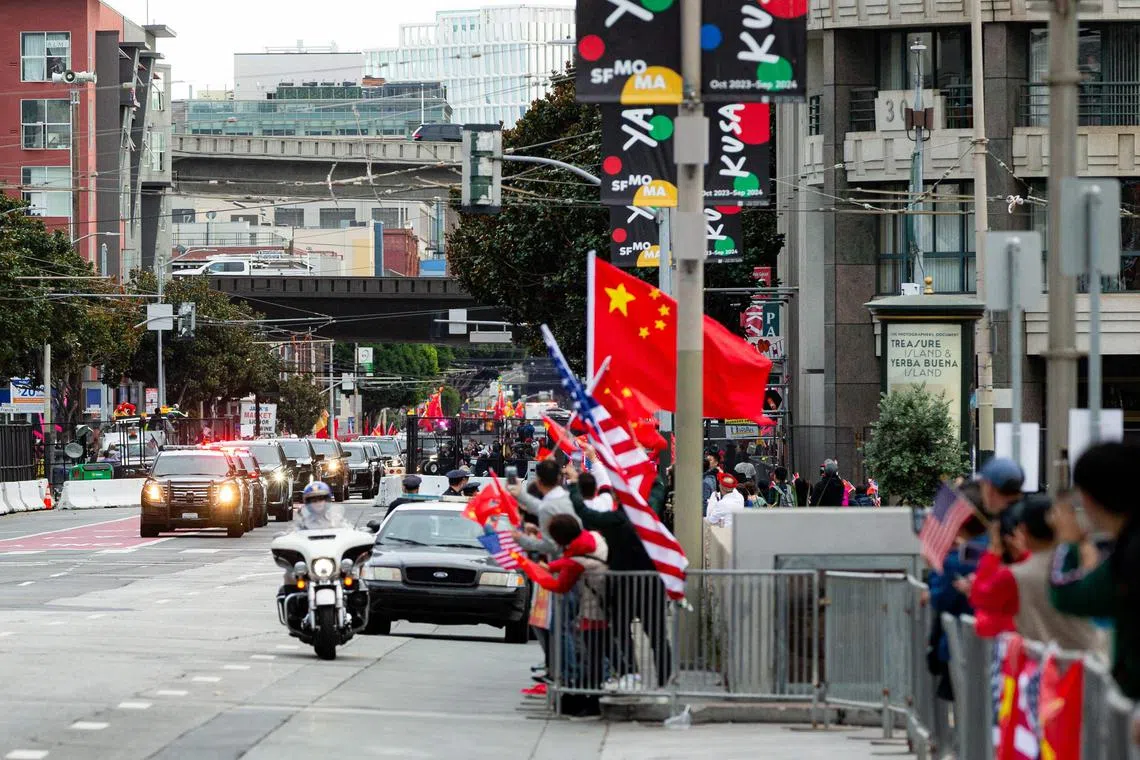 Supporters cheering as Chinese President Xi Jinping's motorcade passes after his arrival in San Francisco on Nov 14.
