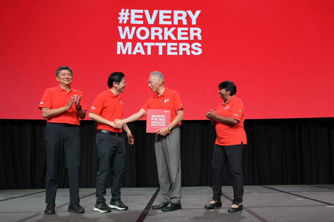 (From left) NTUC secretary-general Ng Chee Meng, DPM Lawrence Wong, PM Lee Hsien Loong and NTUC president K. Thanaletchimi at the annual May Day Rally on May 1.