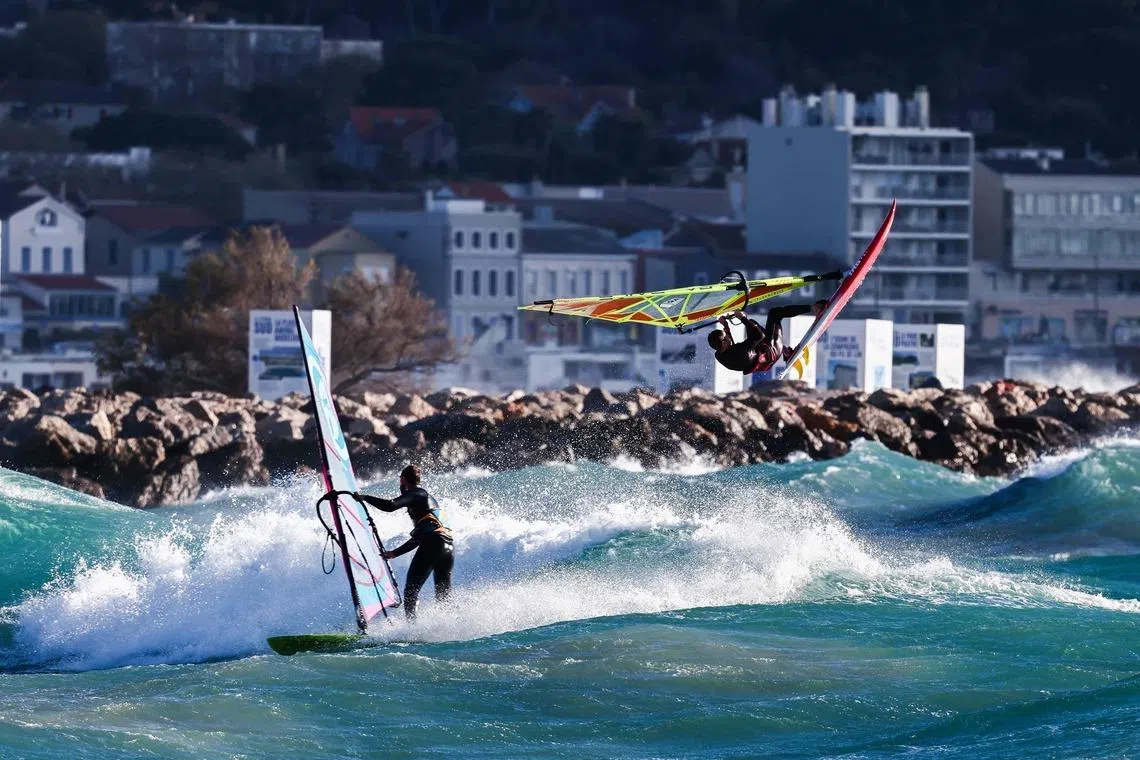 A windsurfer jumping over the waves during a strong mistral wind in Marseille, south-eastern France on March 30, 2026. 