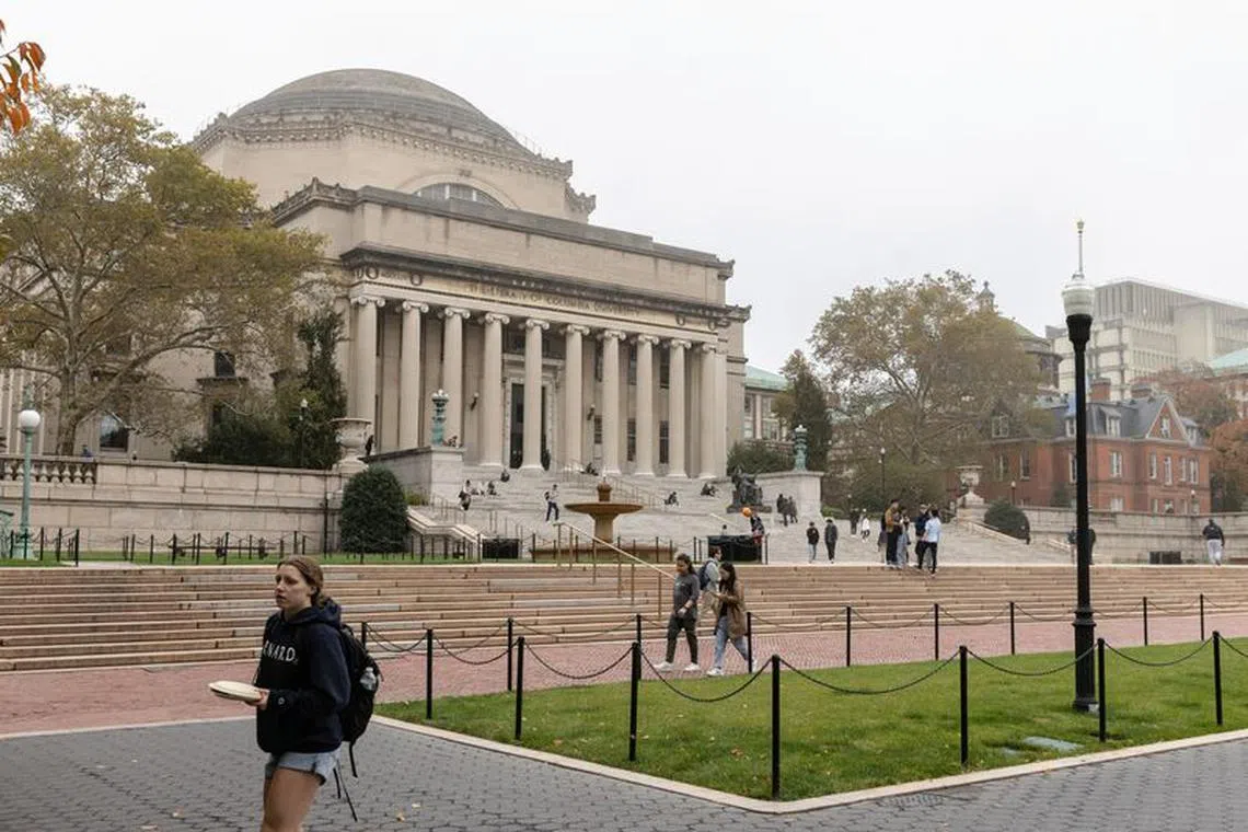 People walk past Columbia University in New York, U.S., October 30, 2023. REUTERS/Jeenah Moon