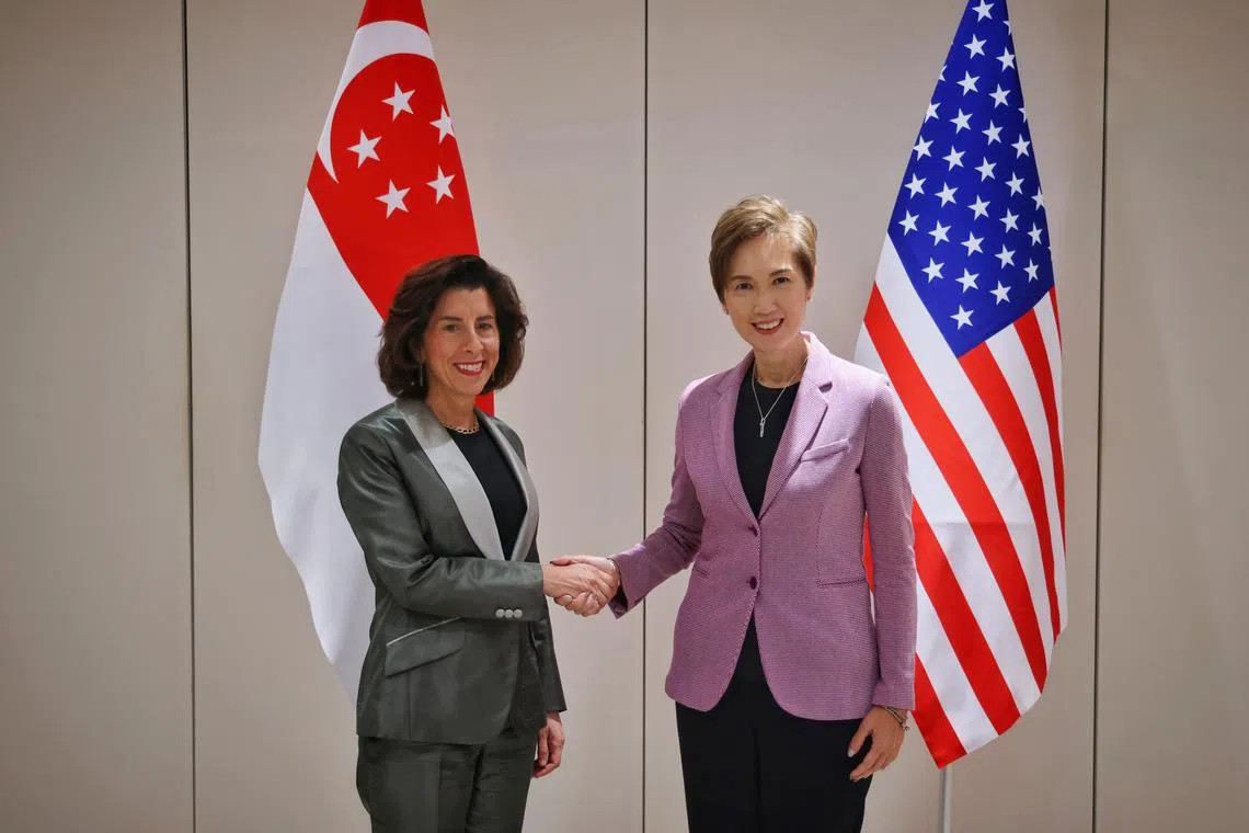 Communications and Information Minister Josephine Teo (right) meeting US Secretary of Commerce Gina Raimondo  before a roundtable on AI on June 5.