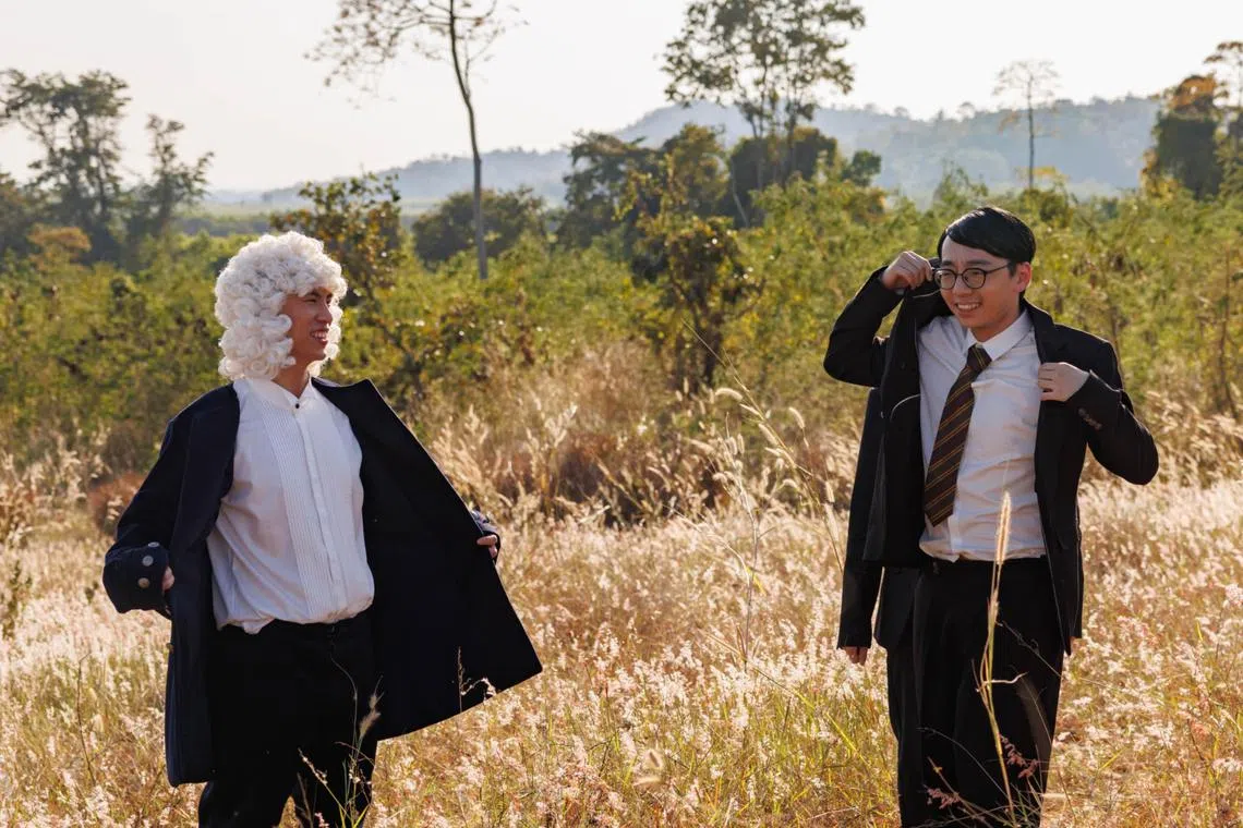 Eddy Chen (left), dressed as composer Johann Sebastian Bach, with Brett Yang, as composer Dmitri Shostakovich, on the set of their music video Forever Symphony.