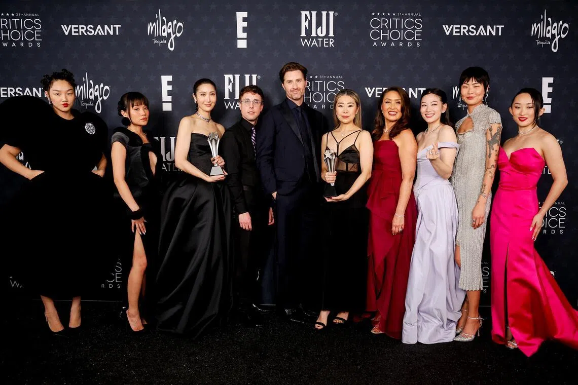 (From left) Audrey Nuna, Rei Ami, Ejae, Mark Sonnenblick, Chris Appelhans, Maggie Kang, Michelle Wong, Arden Cho, May Hong and Ji-young Yoo with the Best Animated Feature award for KPop Demon Hunters at the Critics Choice Awards on Jan 4.