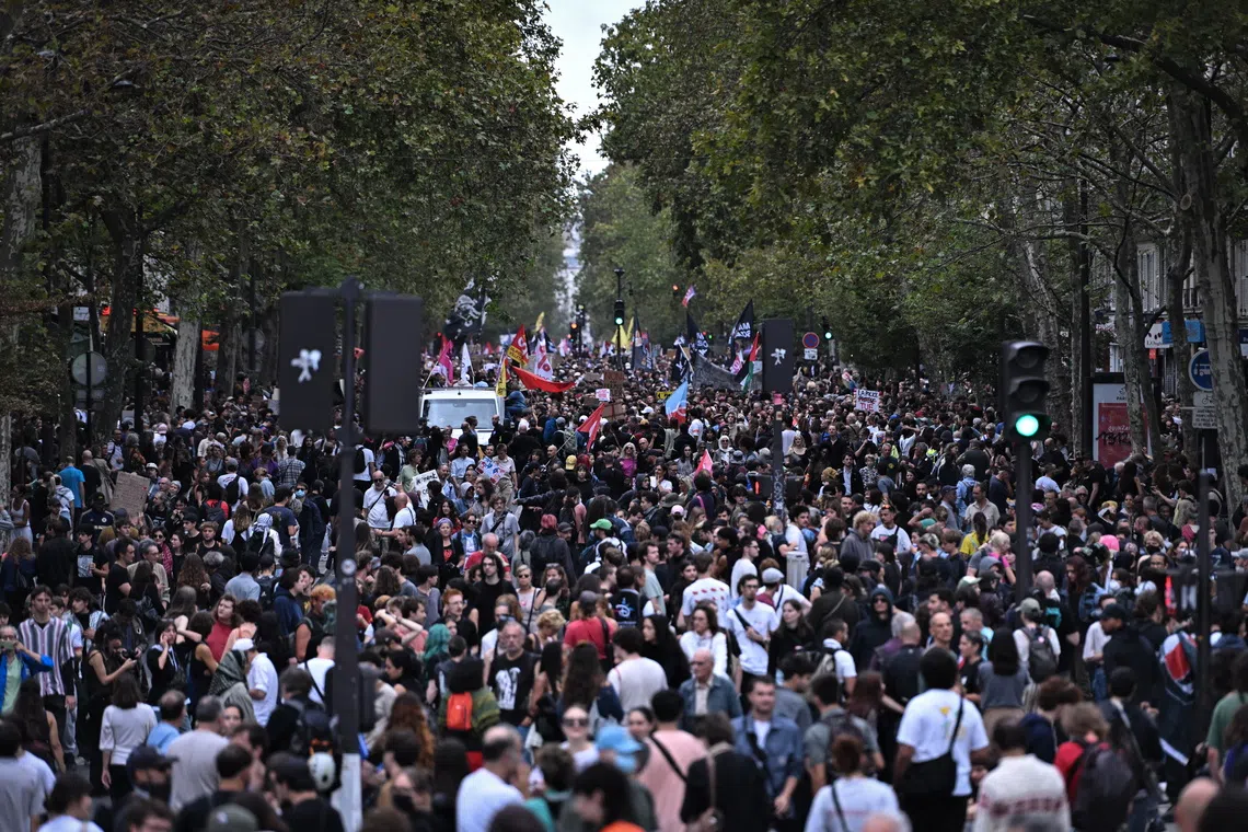 Protestors participate in a national march against proposed legislation regarding police use of firearms in Paris, France, Sept 20, 2026.