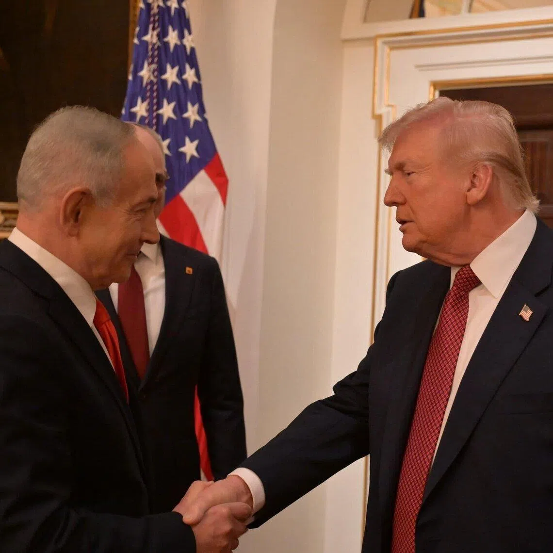 US President Donald Trump (right) welcoming Israeli Prime Minister Benjamin Netanyahu to the White House on Feb 11, in a photo released by Israel. Mr Netanyahu’s visit was lower-key than usual.