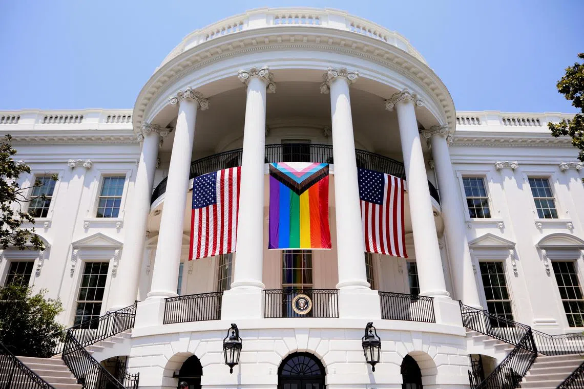 The Progress Pride flag hangs from the balcony of the White House during a Pride Celebration in the South Lawn, hosted by President Joe Biden, in Washington on Saturday.     