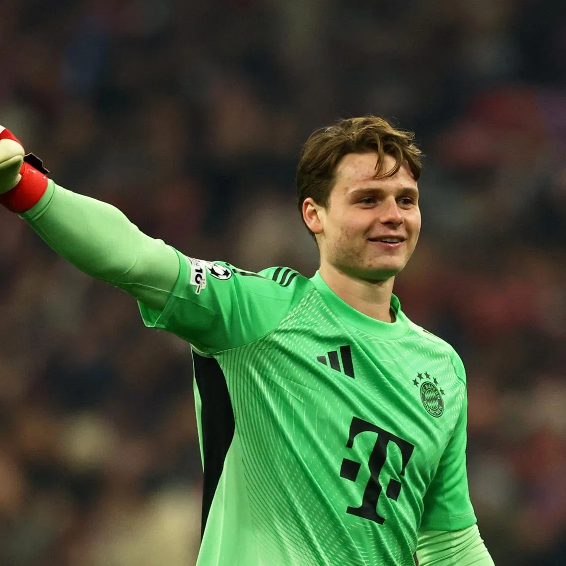 Soccer Football - UEFA Champions League - Round of 16 - Second Leg - Bayern Munich v Atalanta - Allianz Arena, Munich, Germany - March 18, 2026 Bayern Munich's Jonas Urbig celebrates after Lennart Karl scores their third goal REUTERS/Kai Pfaffenbach