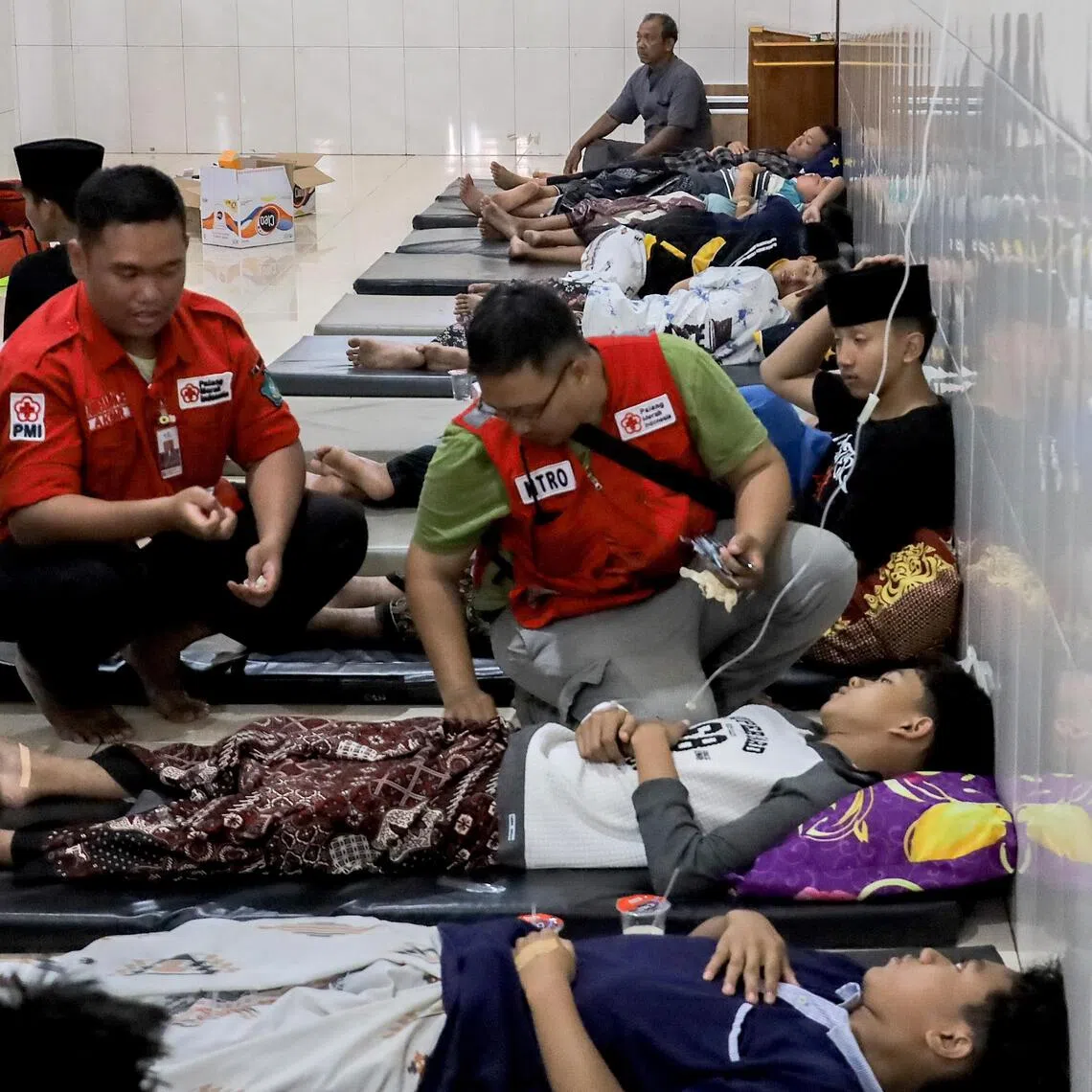 Students suffering from food poisoning receive medical treatment in Sidoarjo, East Java province, Indonesia, on Sept 2.