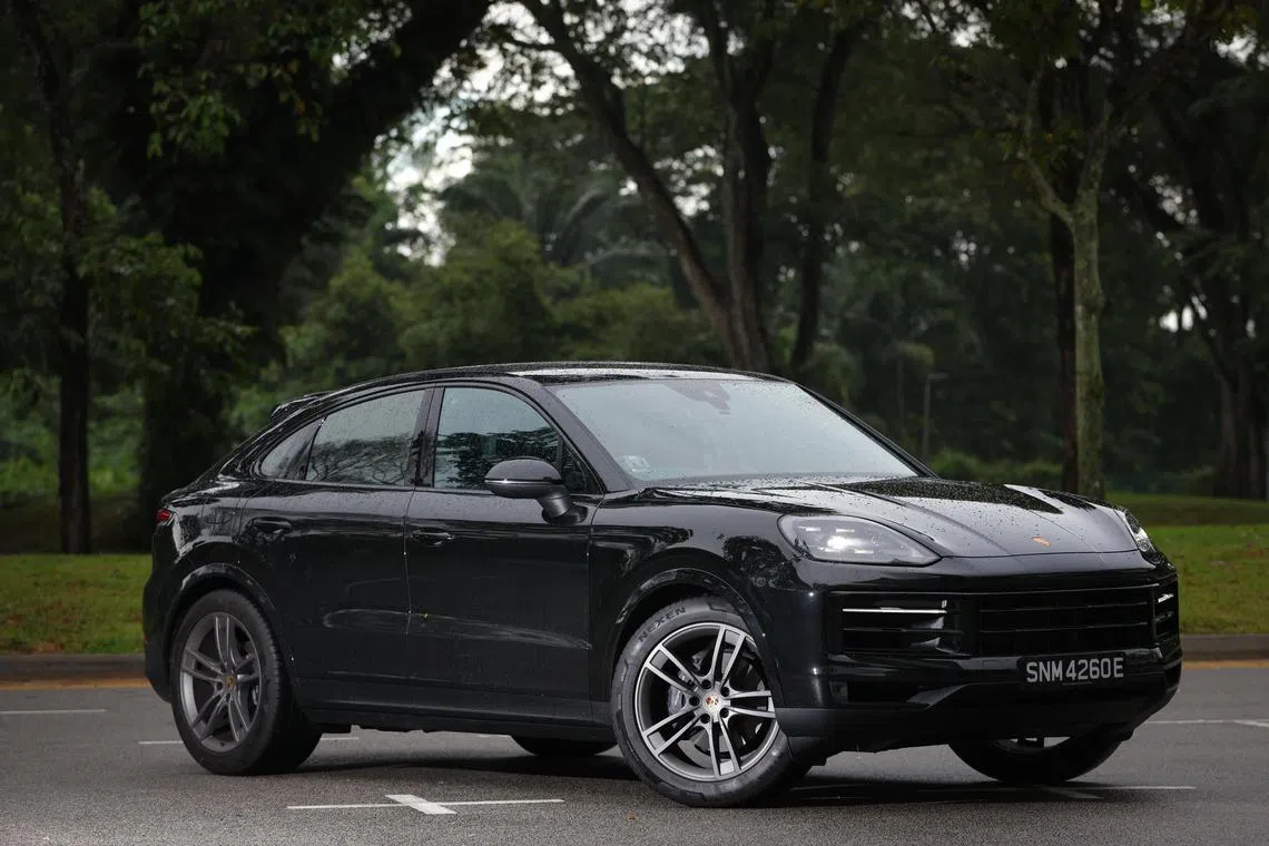 Mean in black: The facelifted Porsche Cayenne Coupe striking a menacing pose.