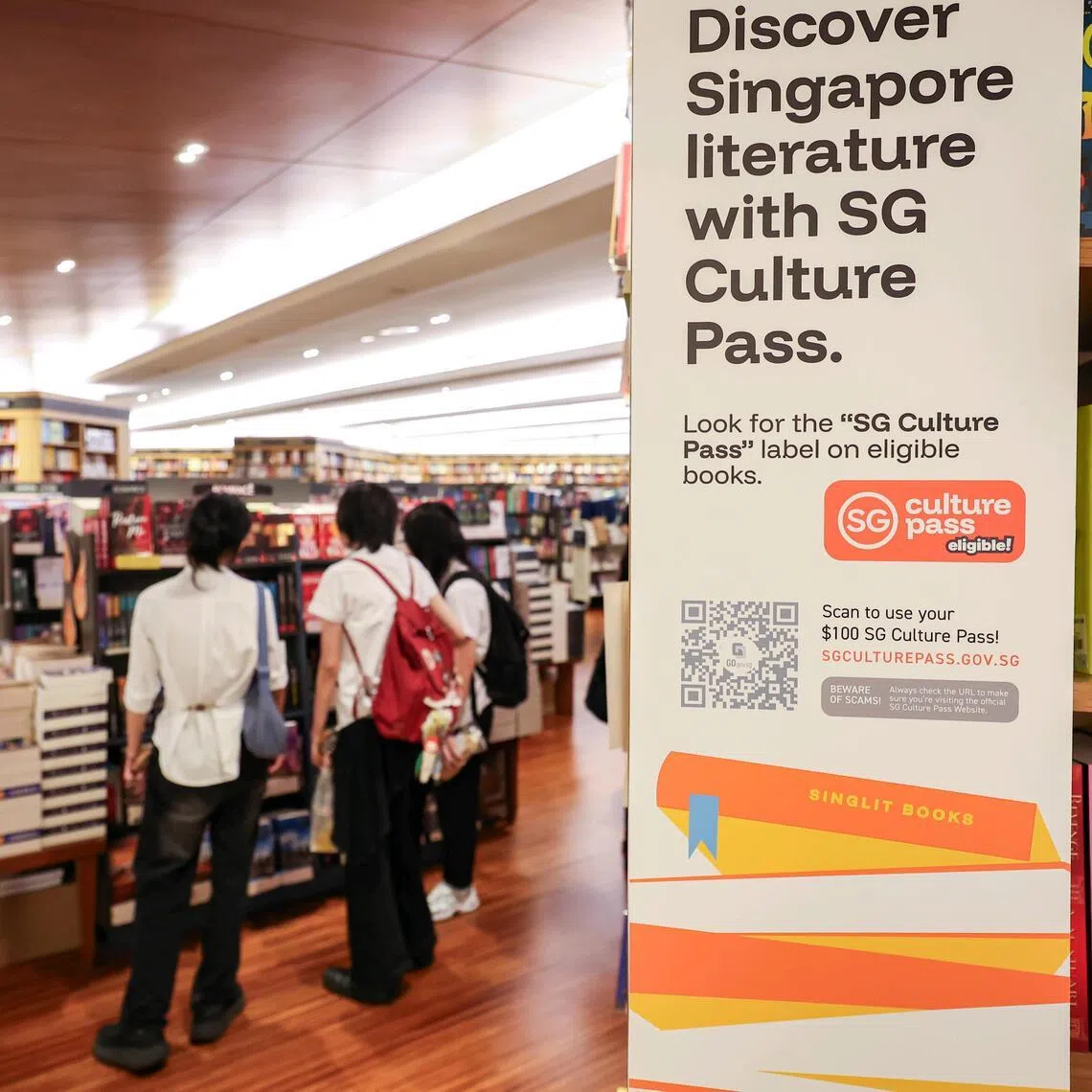 Book displays bearing SG Culture Pass stickers at the Books Kinokuniya main store in Takashimaya Shopping Centre.