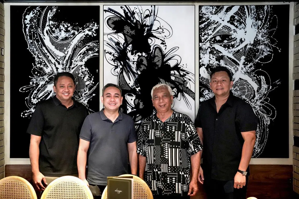 From left: Reza Ali, Najeeb Ali, Ika Sarkasi and Hairul Isa in front of works by Sarkasi Said. 