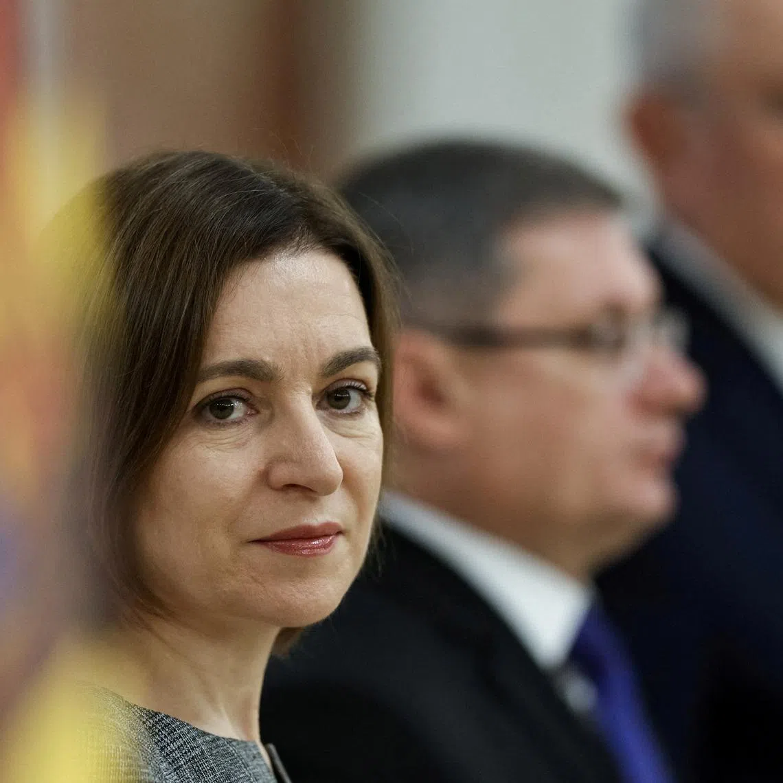 FILE PHOTO: Moldova's President Maia Sandu looks on as she and Parliament Speaker and chairman of the Party of Action and Solidarity (PAS), Igor Grosu, attend a ceremony of Alexandru Munteanu taking his oath as the country’s new Prime Minister, in Chisinau, Moldova, November 1, 2025. REUTERS/Vladislav Culiomza/File Photo