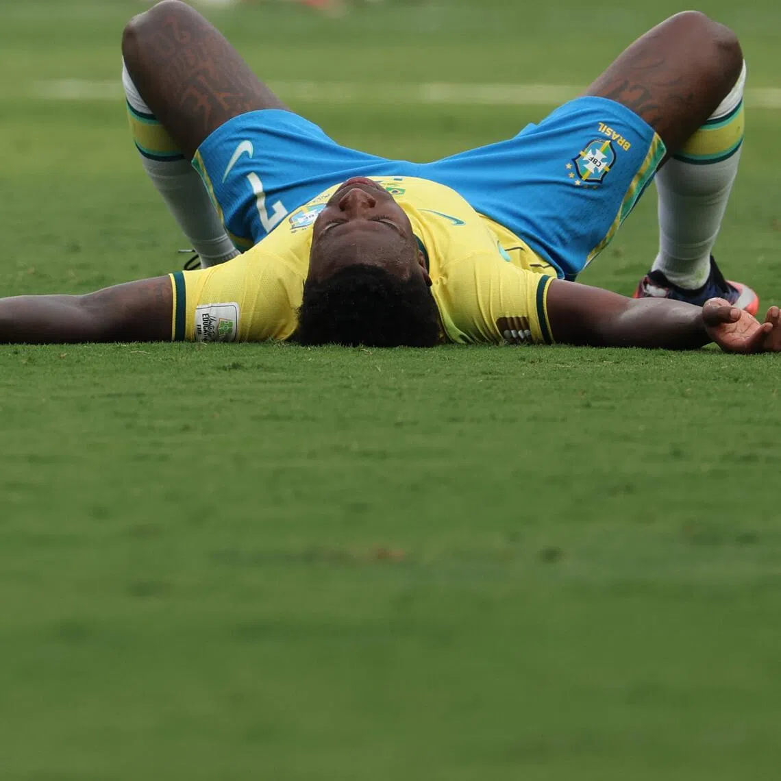 (FILES) Brazil's forward #07 Vinicius Junior reacts after losing the 2026 World Cup round of 16 football match between Brazil and Norway at the New York/New Jersey Stadium in East Rutherford on July 5, 2026. Vinicius Junior apologized to Brazilian fans on July 10, 2026 for the "enormous frustration" caused by their World Cup elimination by Norway and promised to "fight" to restore the might of the Selecao. (Photo by Odd ANDERSEN / AFP)