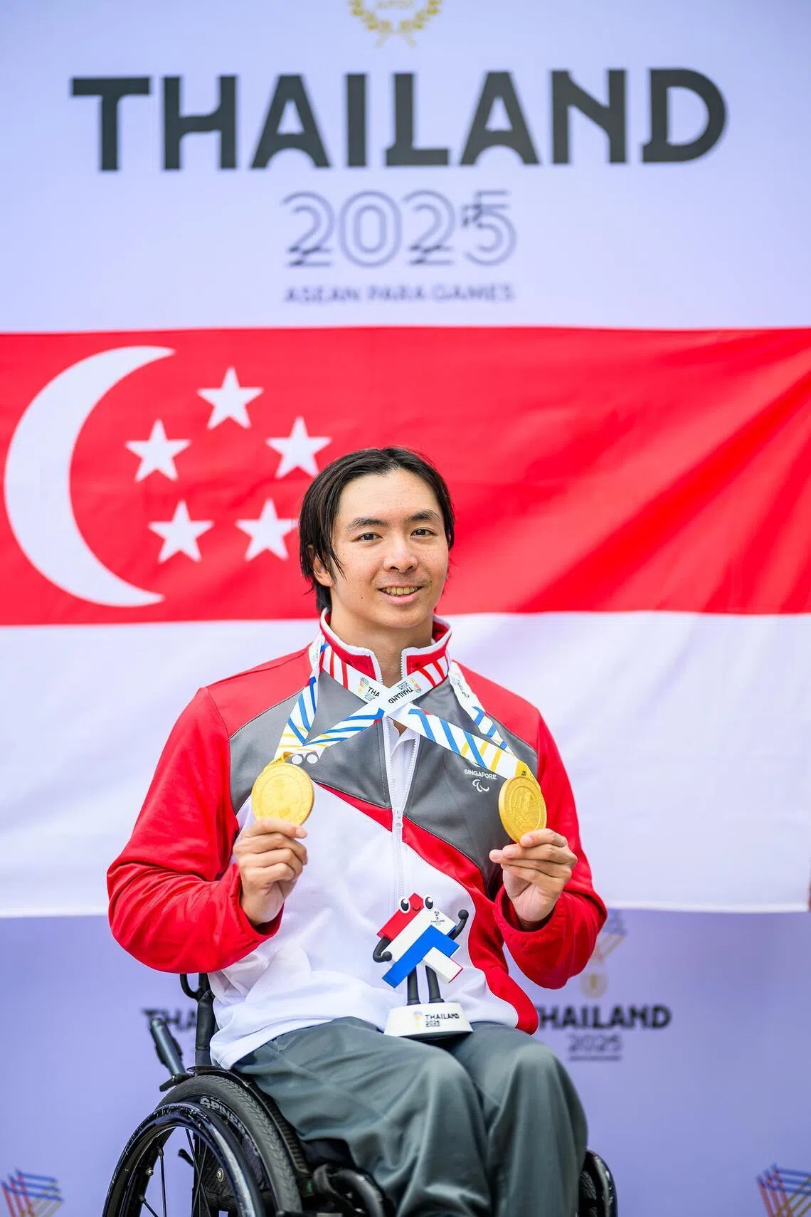 Singaporean para-swimmer Toh Wei Soong with his two gold medals won on Jan 24.