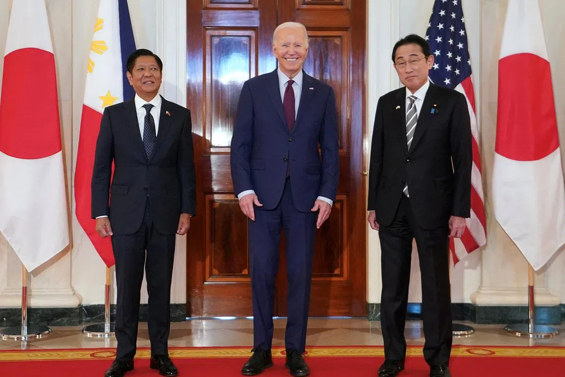 U.S. President Joe Biden hosts Philippines President Ferdinand Marcos Jr. and Japan Prime Minister Fumio Kishida for a trilateral summit at the White House in Washington, U.S., April 11, 2024.  REUTERS/Kevin Lamarque
