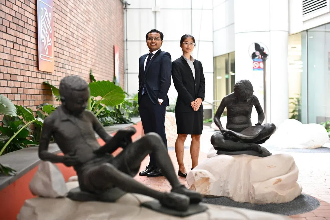 Mr Mohammed Aizam Bin Abd Rahman, 25, and Ms Ko Wen Hui Judith, 22, both 2024 PSC Scholarship recipients, inside the Central Public Library at National Library Building on July 16, 2024.

(ST PHOTO: LIM YAOHUI)