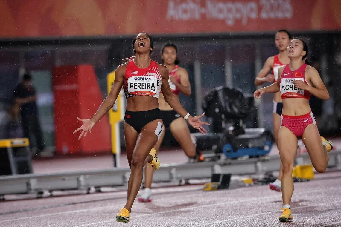 In this memorable photograph of Shanti Pereira at the finish of the 200m, her feet are still in the air and she resembles a winged vehicle about to land.