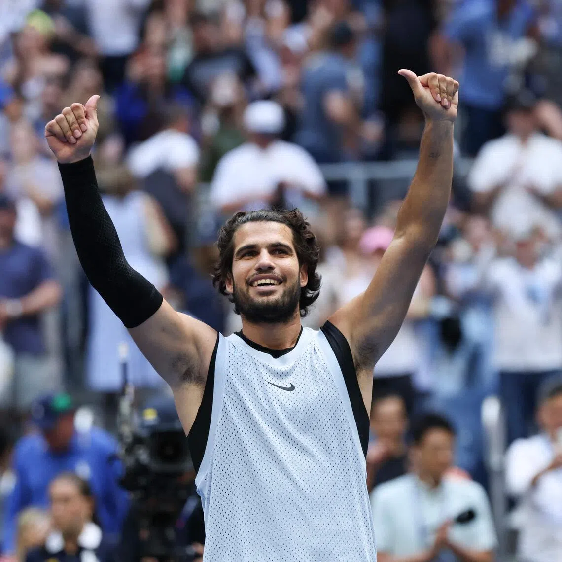TOPSHOT - Spain's Carlos Alcaraz celebrates defeating USA's Tommy Paul in their men's singles round of 16 tennis match on day eight of the US Open tennis tournament at the USTA Billie Jean King National Tennis Center in New York on September 6, 2026. (Photo by TIMOTHY A. CLARY / AFP)