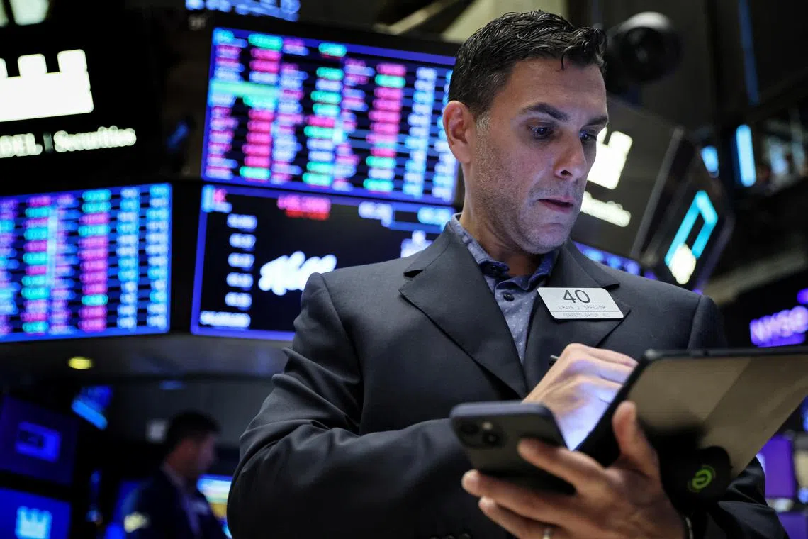 Traders work on the floor of the New York Stock Exchange, in New York City, on March 2, 2023.
