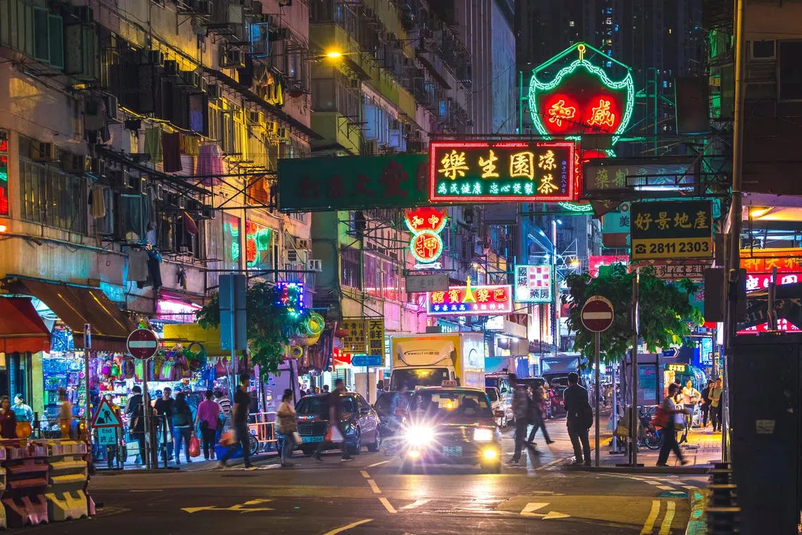 Hong Kong's iconic neon signs have dominated streets and visually defined the territory for both residents and a generation of movie-goers. 