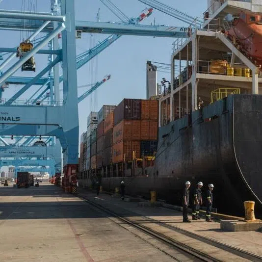 A crew inspecting the Maersk Nansha, a docked container ship, at APM Terminals inside the Port of Mobile in Mobile, Alabama, USA.