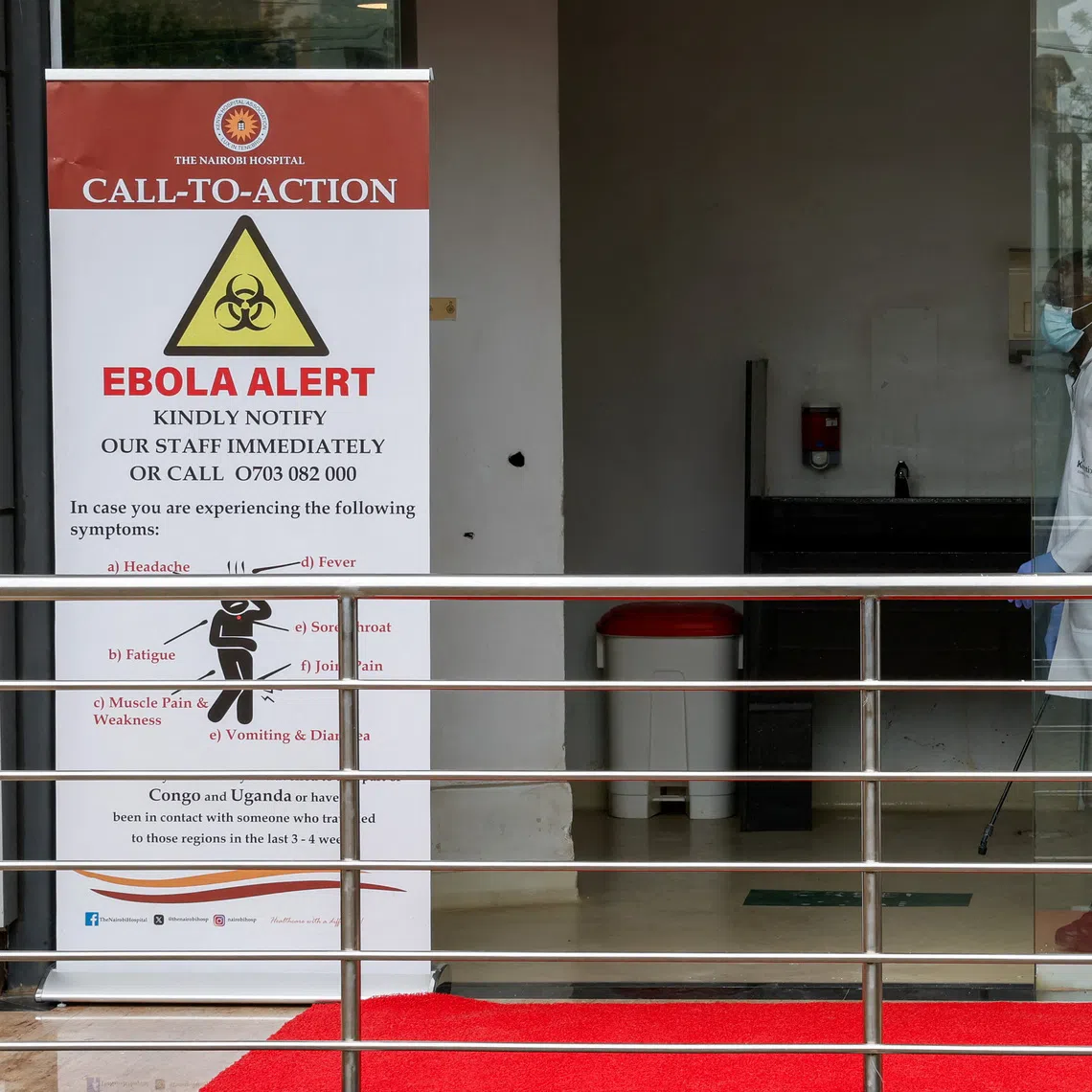 FILE PHOTO: A staff member sanitizes an area at Nairobi Hospital, in Nairobi, Kenya October 7, 2026. REUTERS/Monicah Mwangi/File Photo