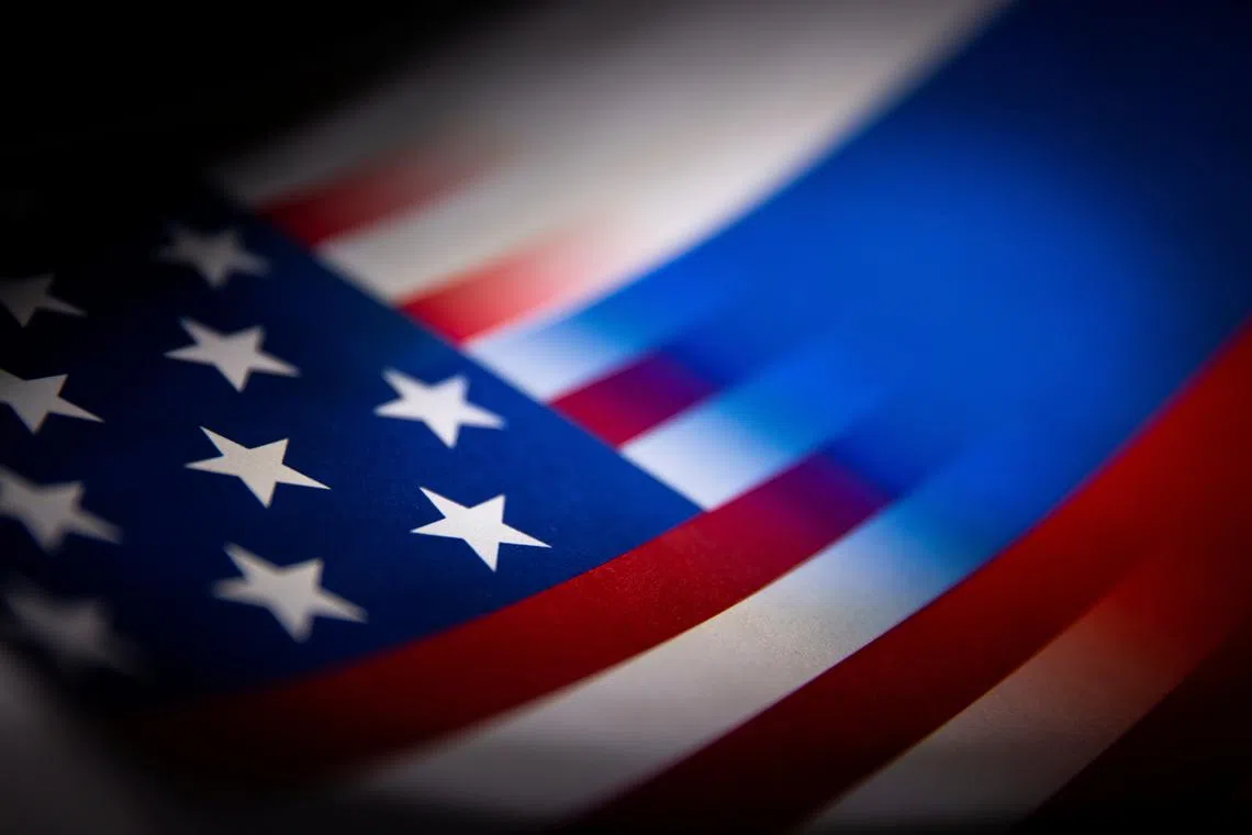 FILE PHOTO: U.S. and Russian flags are seen printed on paper in this illustration taken January 27, 2022. REUTERS/Dado Ruvic/Illustration/File Photo