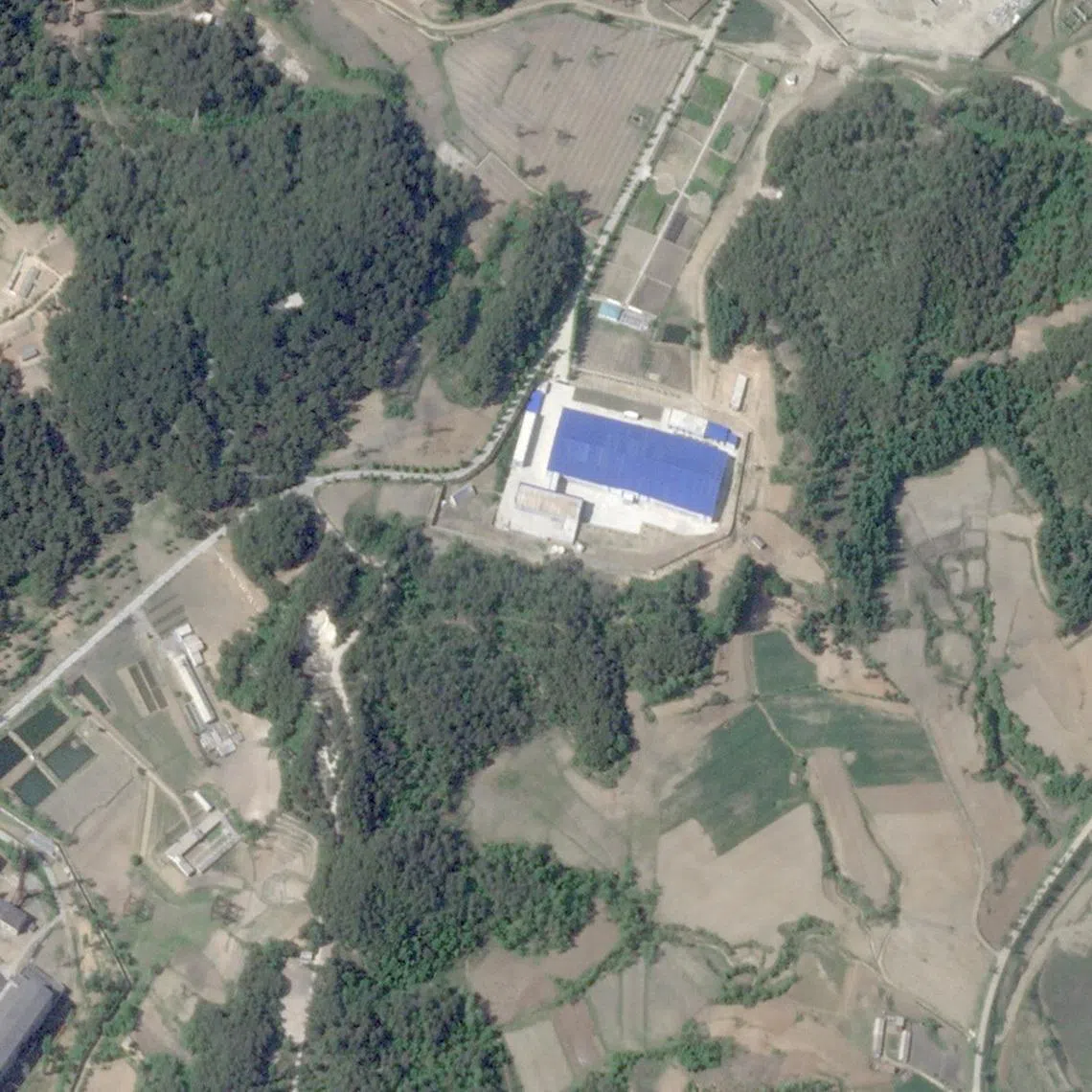 FILE PHOTO: A satellite image shows a nuclear material production factory, in Yongbyon, North Korea, May 17, 2026. 2026 Planet Labs PBC/Handout via REUTERS    THIS IMAGE HAS BEEN SUPPLIED BY A THIRD PARTY. MANDATORY CREDIT.   VERIFICATION: - Coordinates of the facility: 39.785209, 125.759145. - Surrounding areas of the facilities were seen paved starting from May 2025. - Analyst confirmed with Reuters that the location for the Yongbyon plant was most likely where Kim Jong Un had visited recently./File Photo