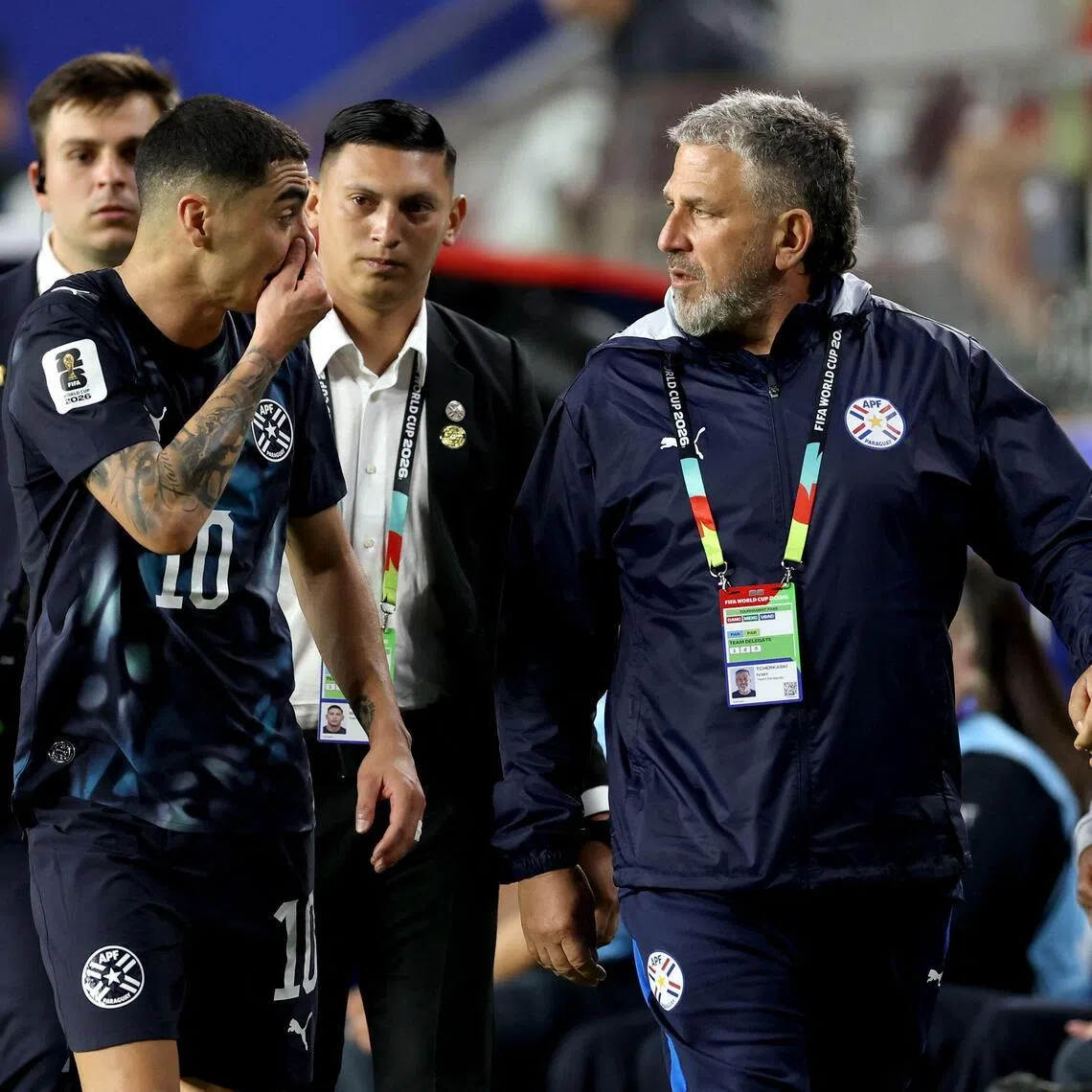Miguel Almiron (left) of Paraguay reacting after receiving a red card for covering his mouth while talking to another player during the game against Turkey on June 19.