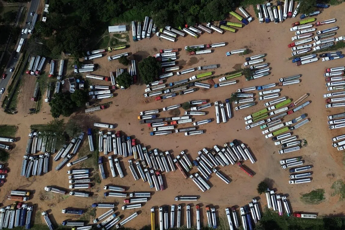 A drone view showing Bolivian fuel trucks waiting at a fuel logistics center for conditions to stabilize in Bolivia amid escalating protests calling for the resignation of Bolivian President Rodrigo Paz, in San Antonio, Paraguay on May 19, 2026.