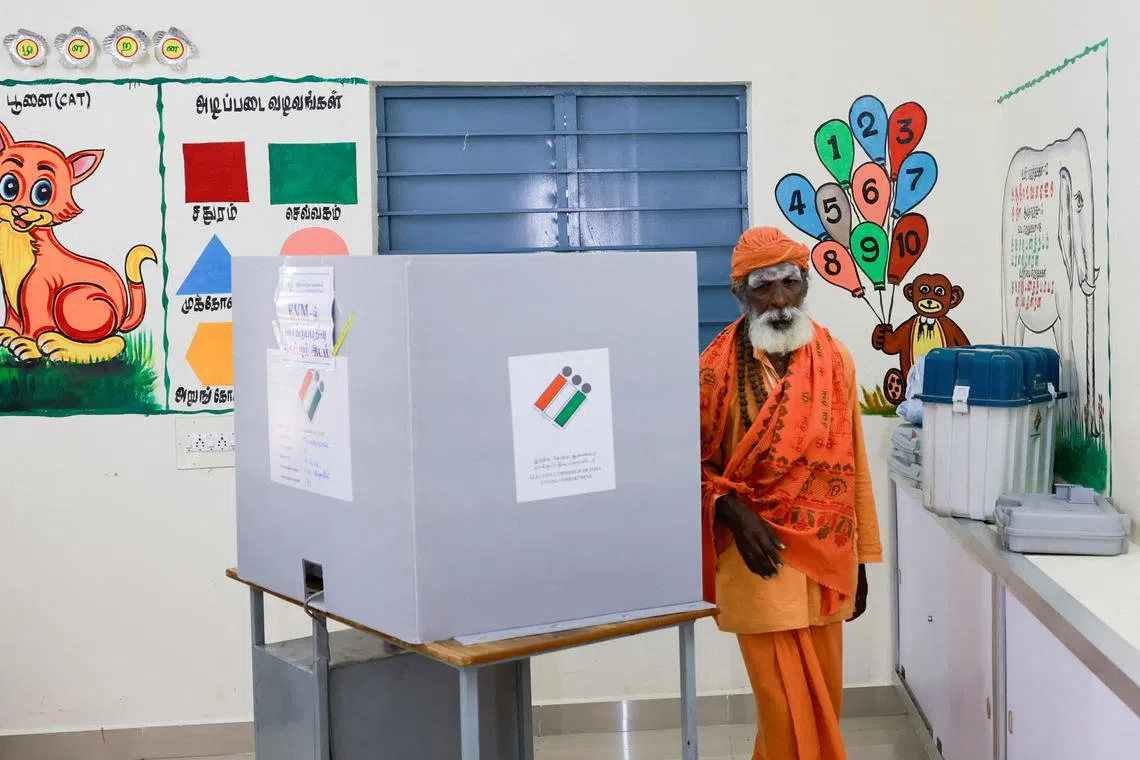 Rama Chandra, 76, a Sadhu or a Hindu holy man, votes at a polling station during the first phase of the general election, at Tiruvannamalai in Tamil Nadu, India, April 19, 2024. REUTERS/ Navesh Chitrakar