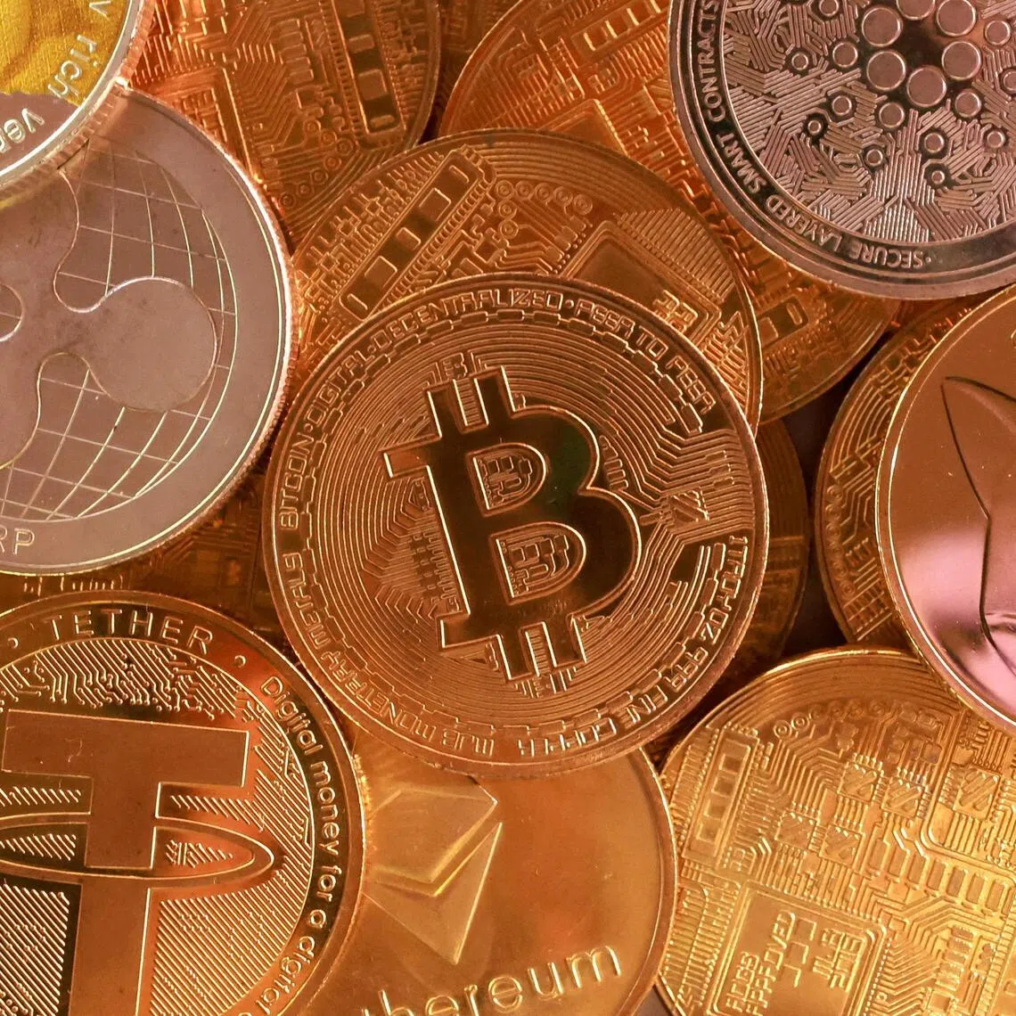 Various cryptocurrencies such as Bitcoin, Tether and XRP. A digital asset downturn is hurting smaller exchanges.