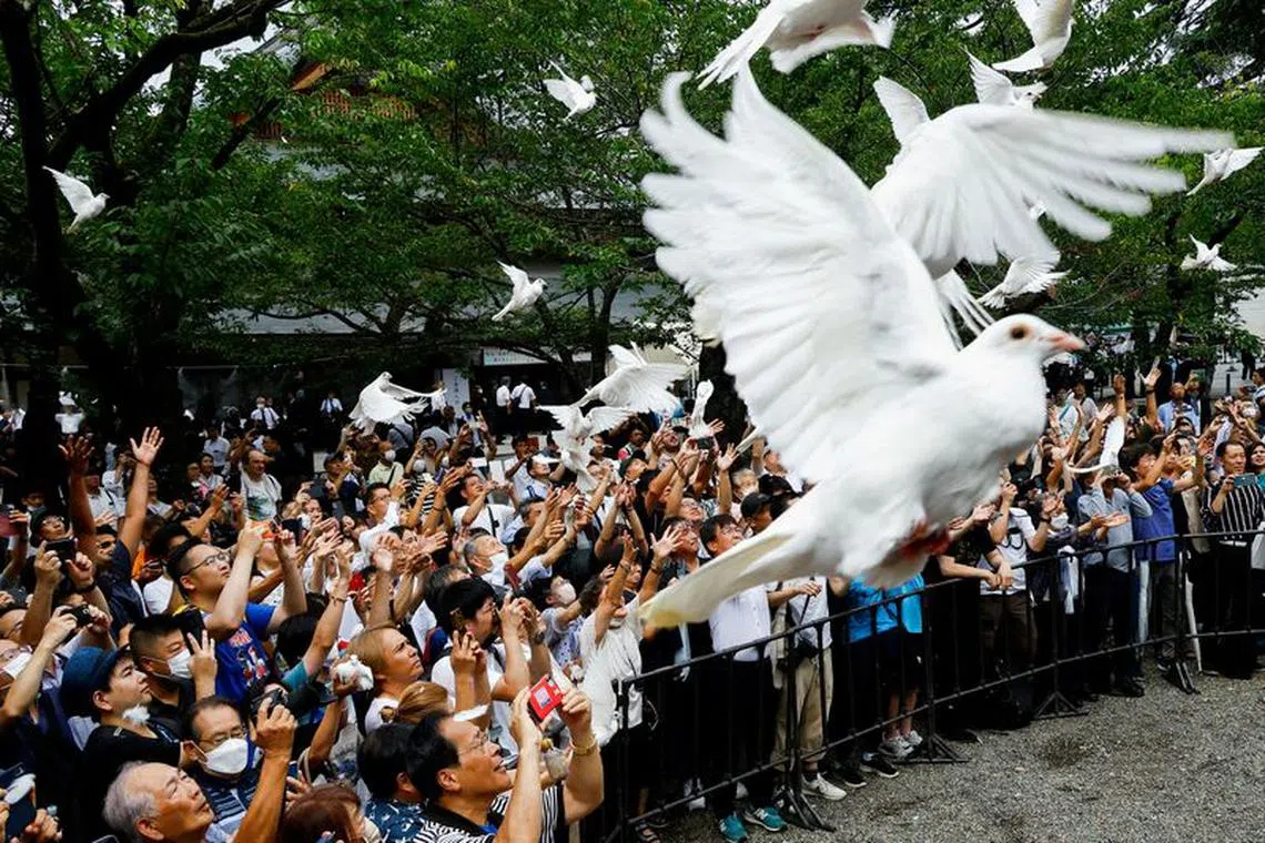People release doves during their visit to the Yasukuni Shrine on the 78th anniversary of Japan's surrender in World War Two in Tokyo, Japan, August 15, 2023. REUTERS/Kim Kyung-Hoon     TPX IMAGES OF THE DAY