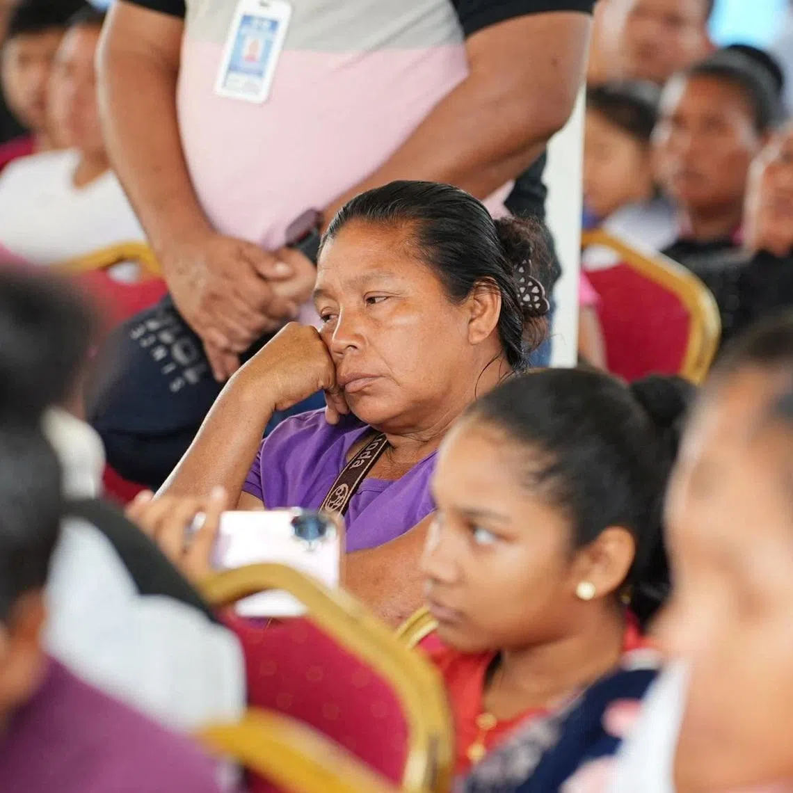 A woman attends an event where Guyana's President Mohamed Irfaan Ali (not pictured) meets with family members of victims of a ferry disaster, after the MV Barima, a ferry that was travelling from the capital Georgetown to the northwest village of Port Kaituma, capsized off the coast over the weekend, in a location given as Mabaruma, Guyana, in this handout image released July 20, 2026. Office of the President - Guyana via Facebook/Handout via REUTERS    THIS IMAGE HAS BEEN SUPPLIED BY A THIRD PARTY. NO RESALES. NO ARCHIVES. MANDATORY CREDIT. BEST QUALITY AVAILABLE.