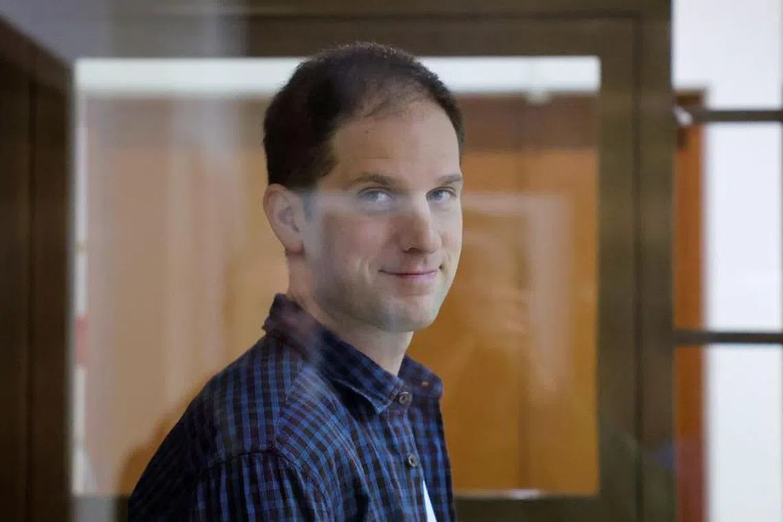 Wall Street Journal reporter Evan Gershkovich stands inside an enclosure for defendants before a court hearing to consider an appeal against his pre-trial detention on espionage charges in Moscow, Russia, October 10, 2023. REUTERS/Evgenia Novozhenina/ File Photo